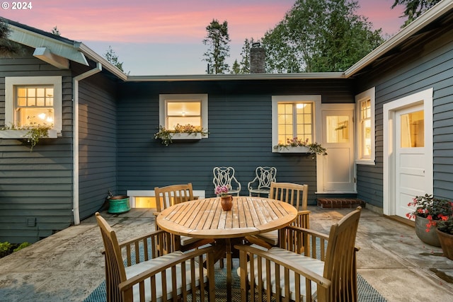 view of patio terrace at dusk