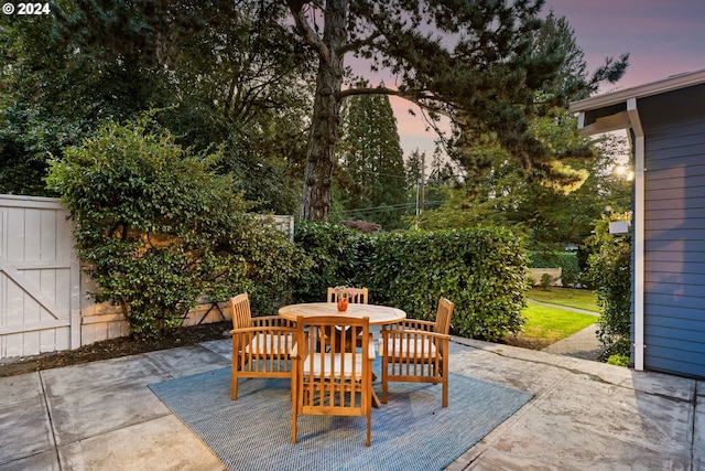 view of patio terrace at dusk