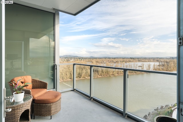 balcony featuring a water view