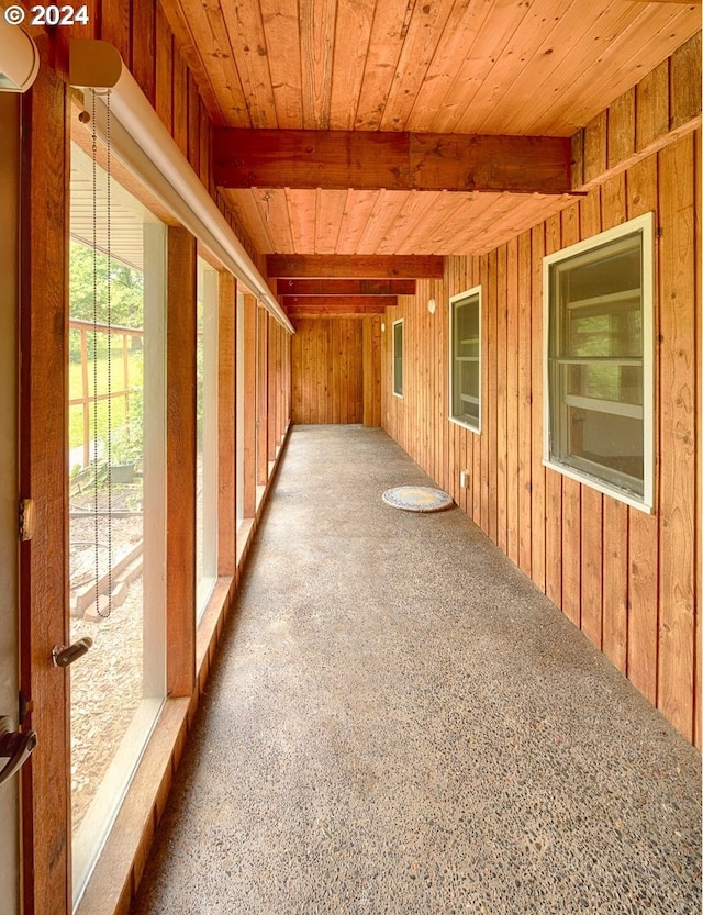 interior space featuring beam ceiling and wood ceiling