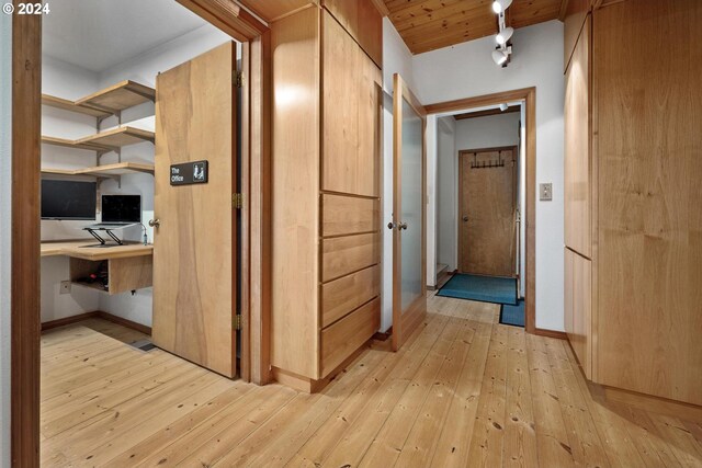 hallway featuring wooden ceiling and light wood-type flooring