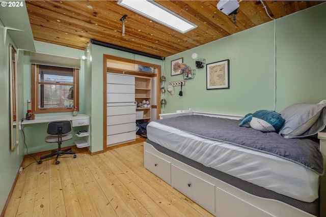 55696 Viewcrest Pl, Warren, OR 97053 - bedroom with light wood-style floors, a desk, and wooden ceiling