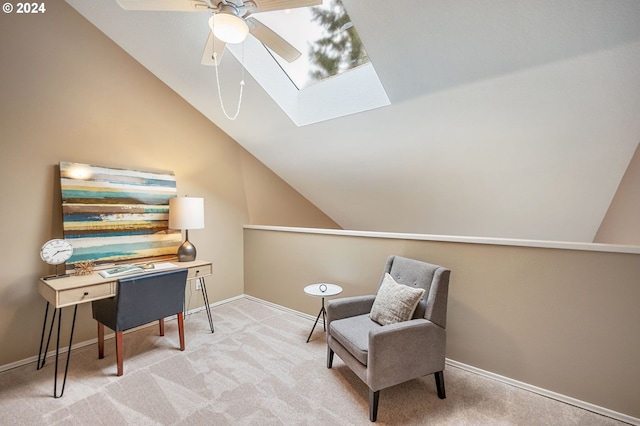 living area with lofted ceiling with skylight, carpet, and ceiling fan