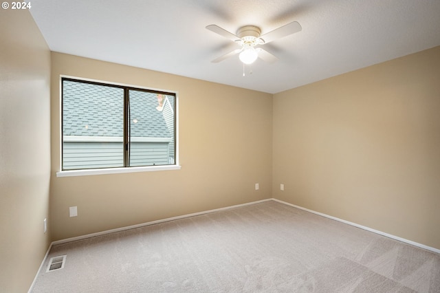 carpeted empty room with ceiling fan