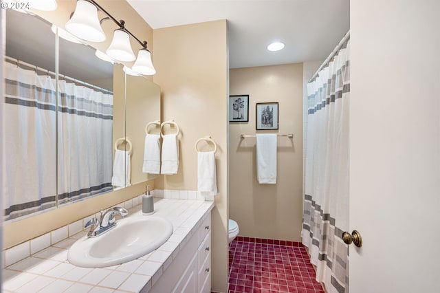 bathroom featuring vanity, toilet, and a shower with curtain