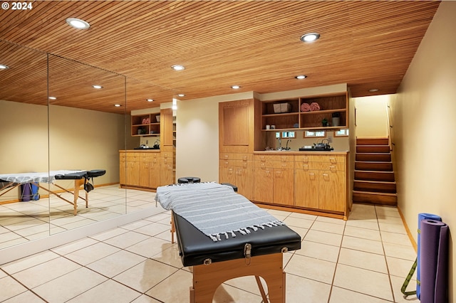 recreation room with light tile patterned flooring and wood ceiling