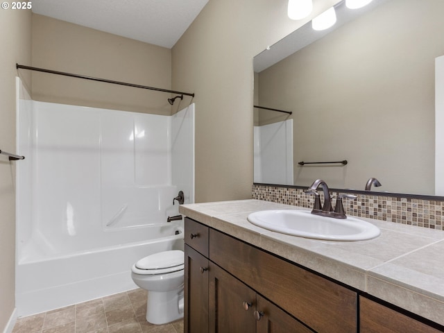 full bath featuring tasteful backsplash, vanity, toilet, and tub / shower combination