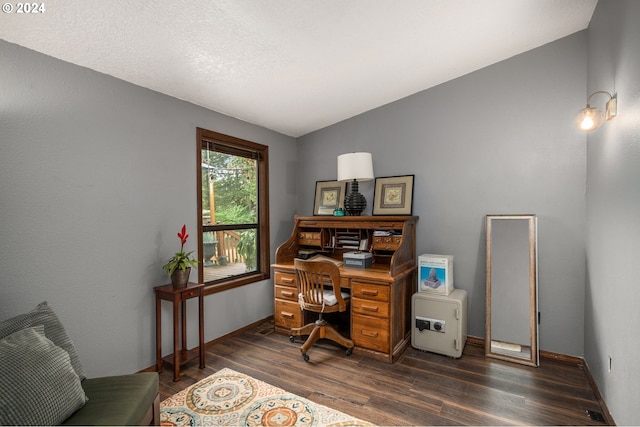 office with lofted ceiling and dark hardwood / wood-style floors