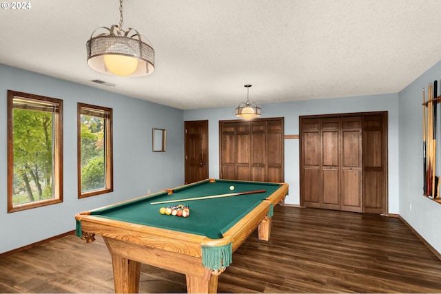 game room featuring a textured ceiling, dark hardwood / wood-style flooring, and billiards