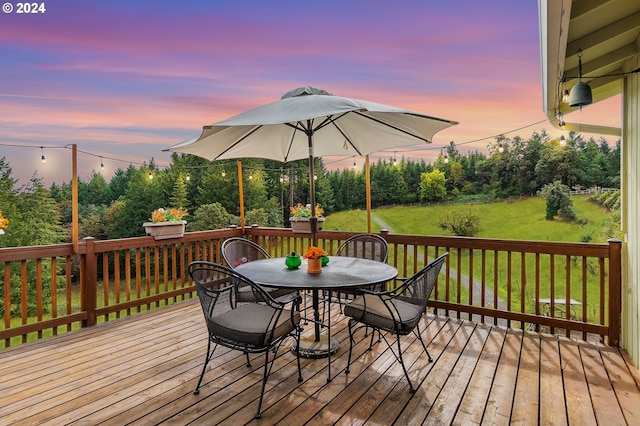 deck at dusk with a yard