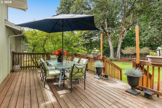 wooden terrace with a yard