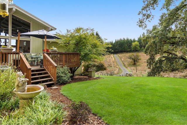 view of yard with a deck