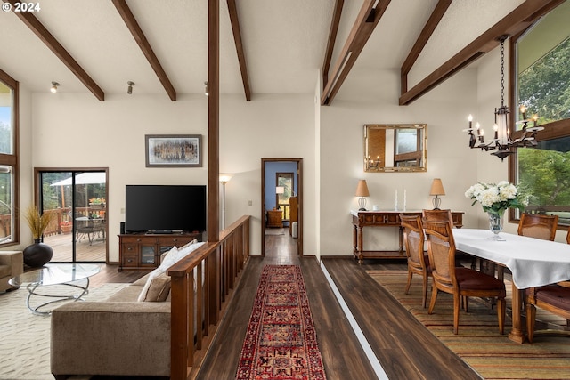 living room with a notable chandelier, hardwood / wood-style flooring, beamed ceiling, and plenty of natural light