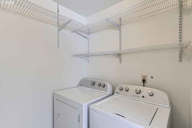 washroom with washing machine and dryer