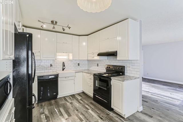 kitchen featuring sink, black appliances, dark wood-type flooring, and white cabinets