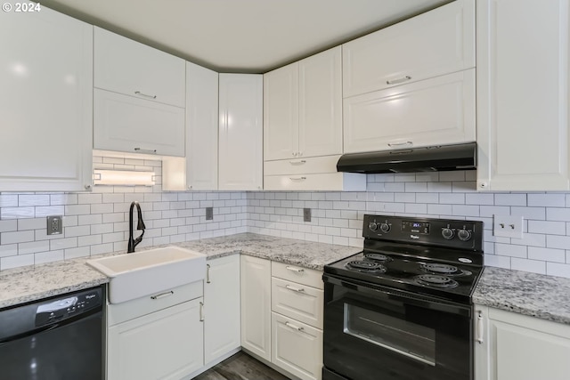 kitchen featuring white cabinetry, sink, backsplash, and black appliances