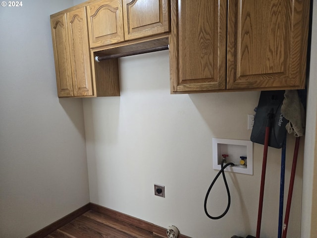 laundry area featuring hookup for an electric dryer, cabinet space, baseboards, dark wood-style flooring, and washer hookup