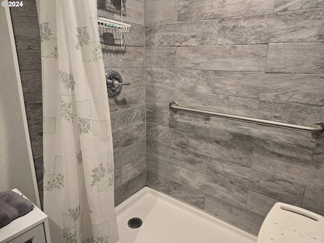 bathroom featuring a shower stall