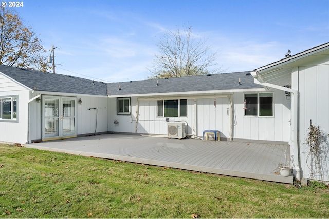 back of property featuring ac unit, a yard, and a deck