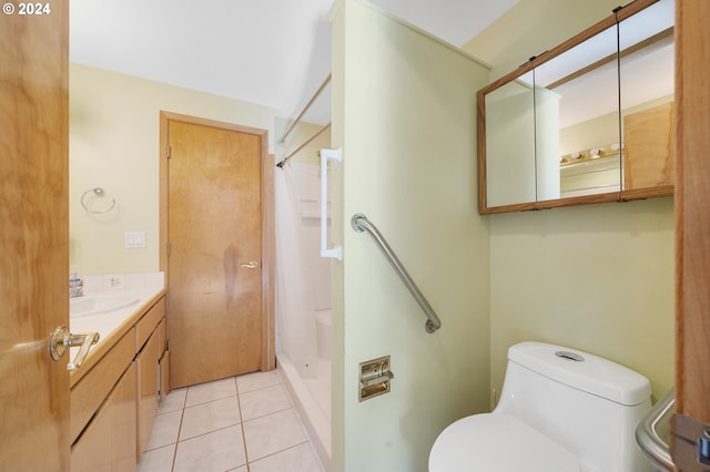 bathroom featuring vanity, toilet, tile patterned floors, and curtained shower