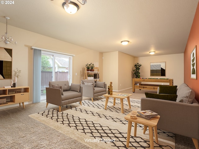 carpeted living room with an inviting chandelier