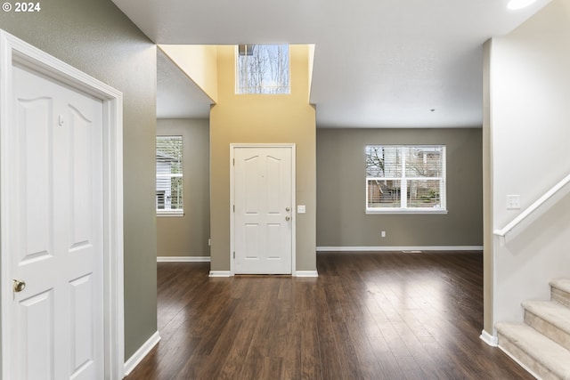 foyer with dark hardwood / wood-style flooring