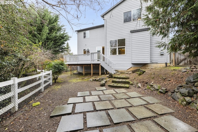 rear view of property featuring a deck