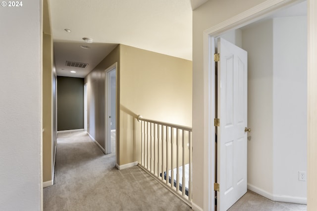 hallway with light carpet