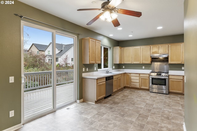 kitchen featuring light brown cabinets, stainless steel appliances, ceiling fan, and sink