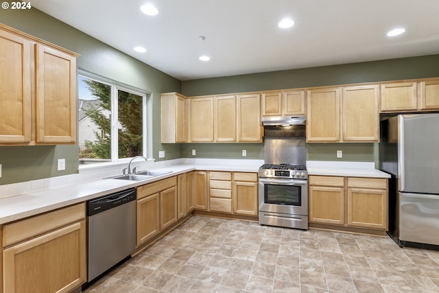 kitchen with sink, light brown cabinets, and appliances with stainless steel finishes