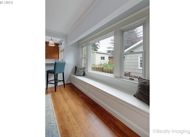 interior space with light wood-type flooring and ornamental molding