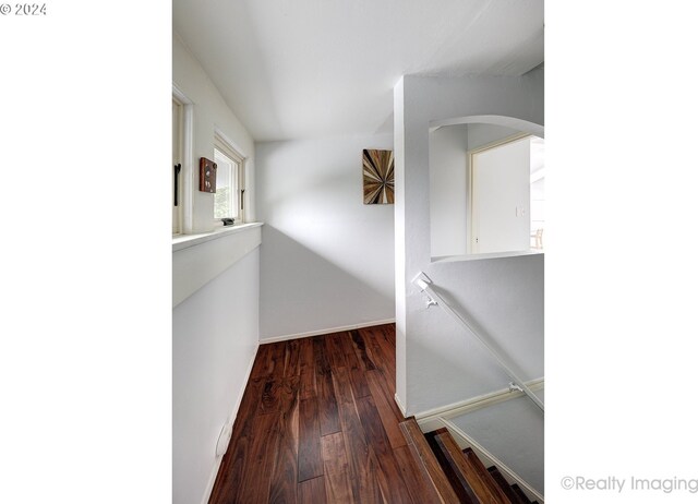 hall with dark hardwood / wood-style flooring