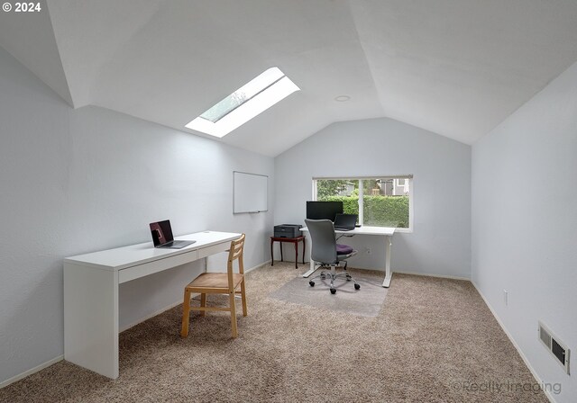 office area featuring light carpet and lofted ceiling