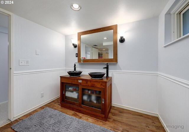 interior space featuring hardwood / wood-style flooring and sink