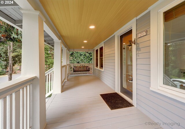 wooden terrace featuring a porch