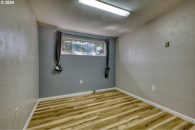 unfurnished room featuring light hardwood / wood-style floors