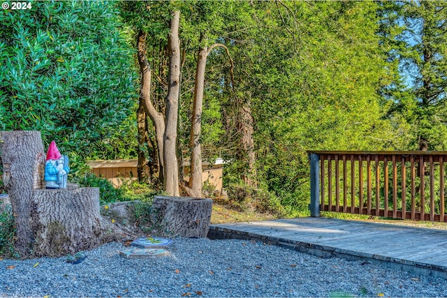view of gate featuring a wooden deck