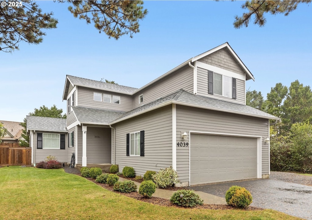 front of property featuring a garage and a front lawn