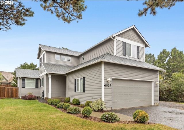 front of property featuring a garage and a front lawn