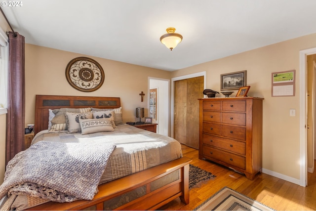 bedroom with light hardwood / wood-style floors