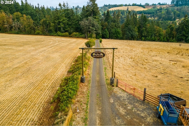 birds eye view of property with a rural view