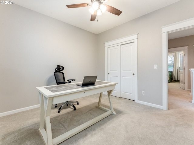 office featuring ceiling fan and light colored carpet