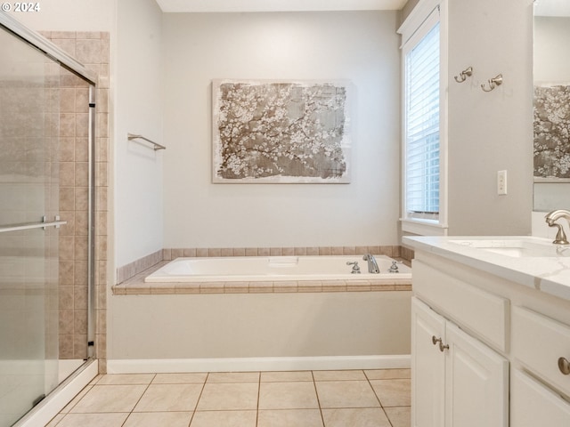 bathroom with tile patterned flooring, vanity, and plus walk in shower