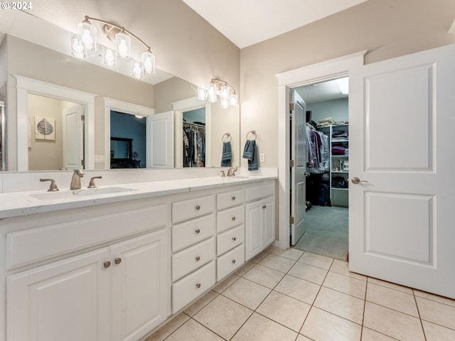 bathroom featuring tile patterned floors and vanity