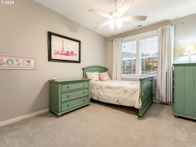 bedroom featuring light colored carpet and ceiling fan