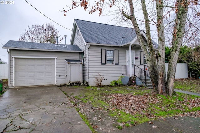 view of front of property with a garage