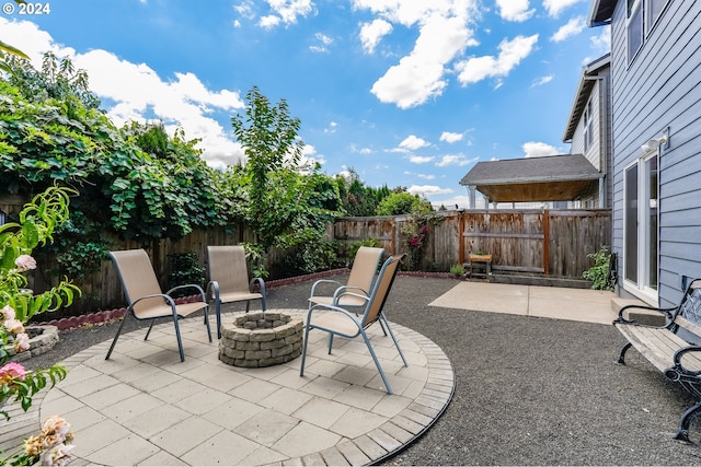 view of patio / terrace featuring an outdoor fire pit