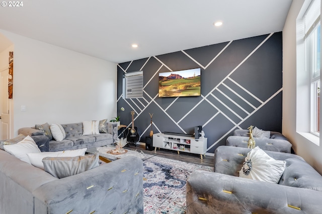 living room featuring a healthy amount of sunlight and hardwood / wood-style floors