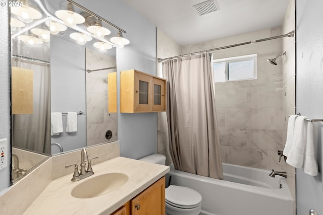 full bathroom featuring shower / bath combo, vanity, and toilet