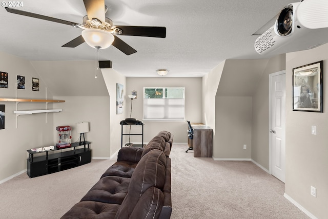 carpeted living room featuring ceiling fan, a textured ceiling, and lofted ceiling